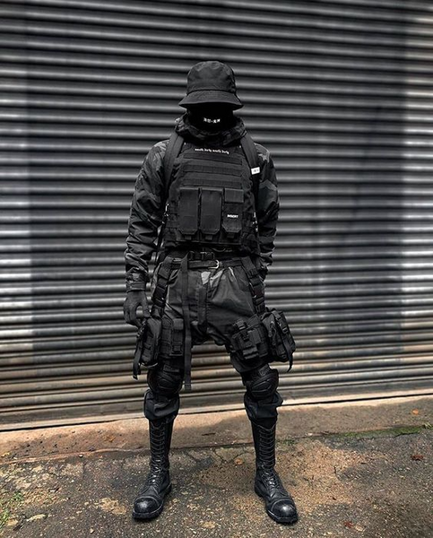 man wearing warcore outfits in the street